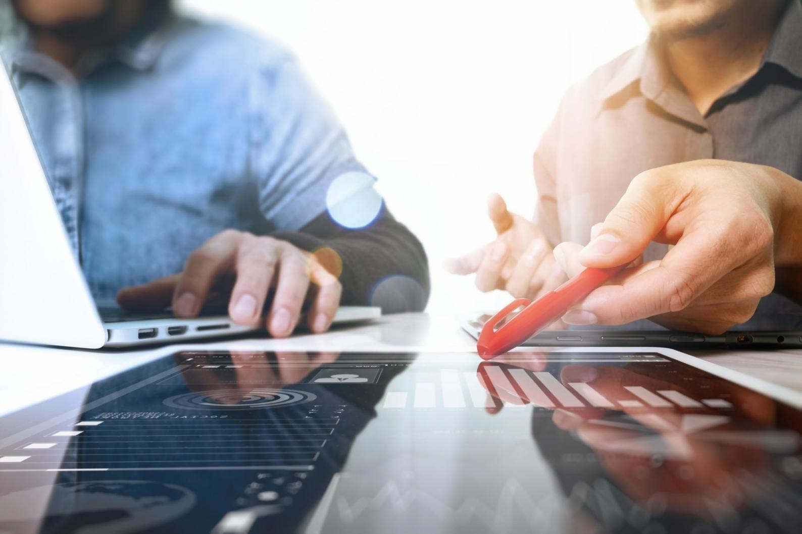 Students working with mobile testing equipment and debugging tools